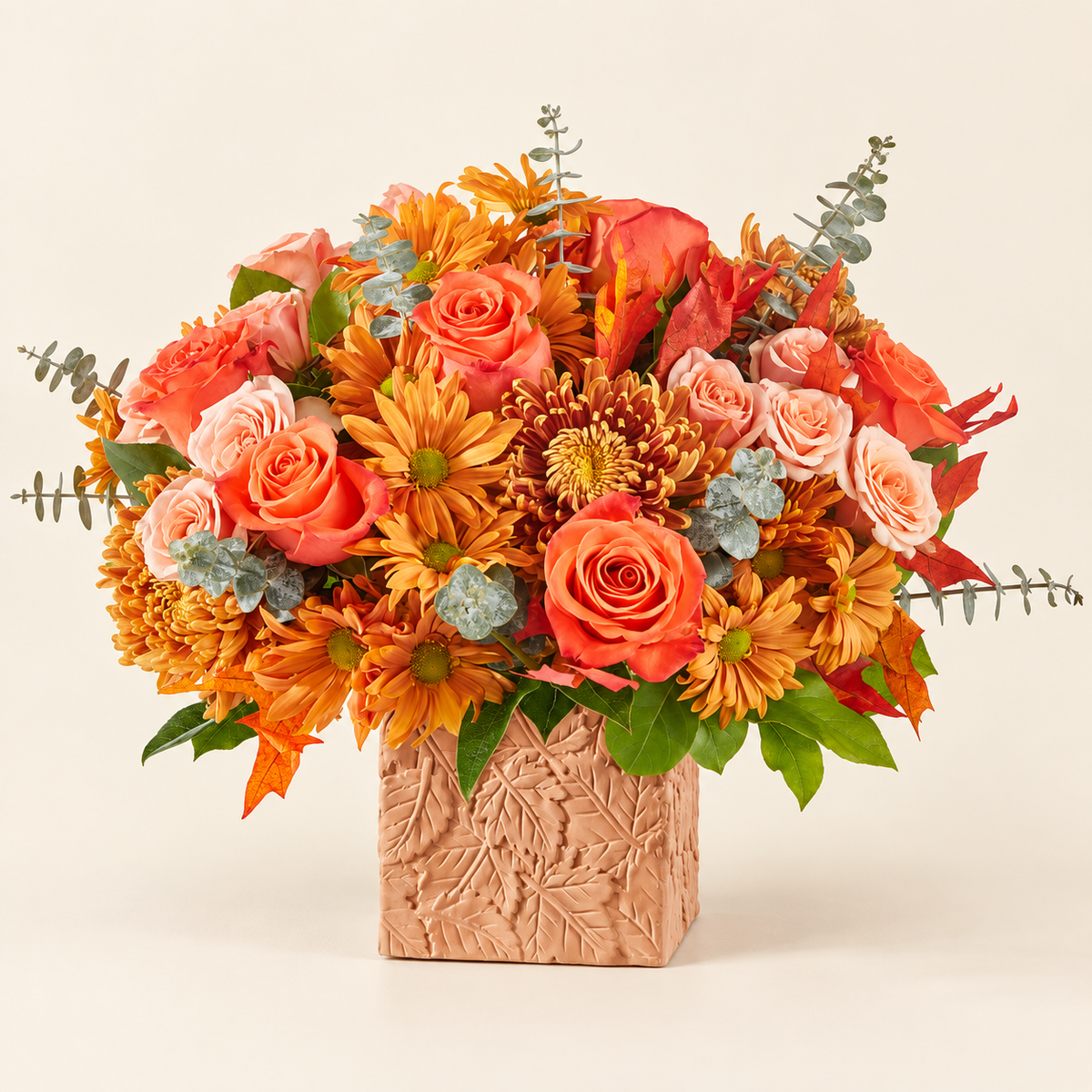 Close-up of autumn bouquet with orange roses and daisies from Baldwin Park florist