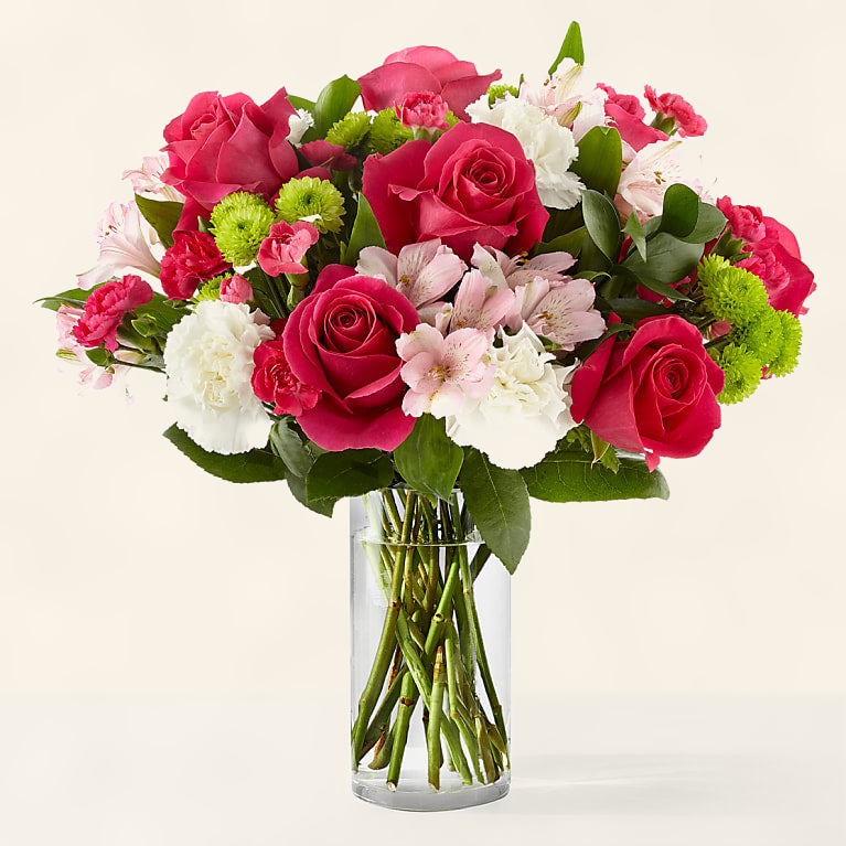 Sweet and Pretty bouquet with red roses, pink and white romantic blooms in a clear glass vase, hand-arranged by Baldwin Park florist