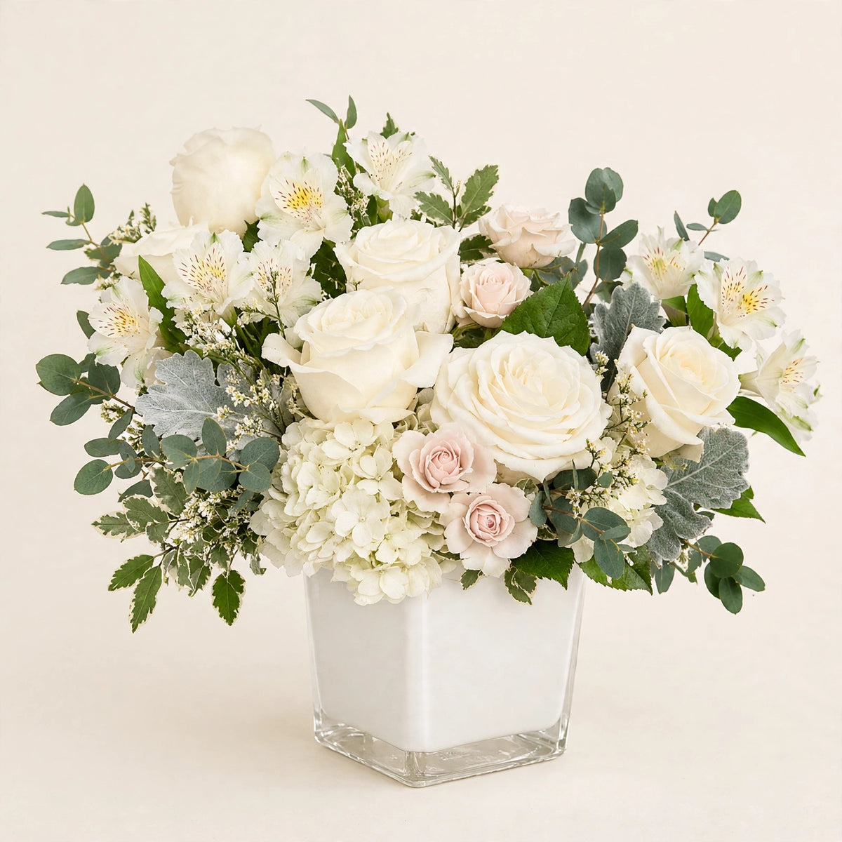 Ivory Garden Bouquet ā creamy white roses, blush spray roses and hydrangea in a white cube vase by LaLa Florist in Baldwin Park