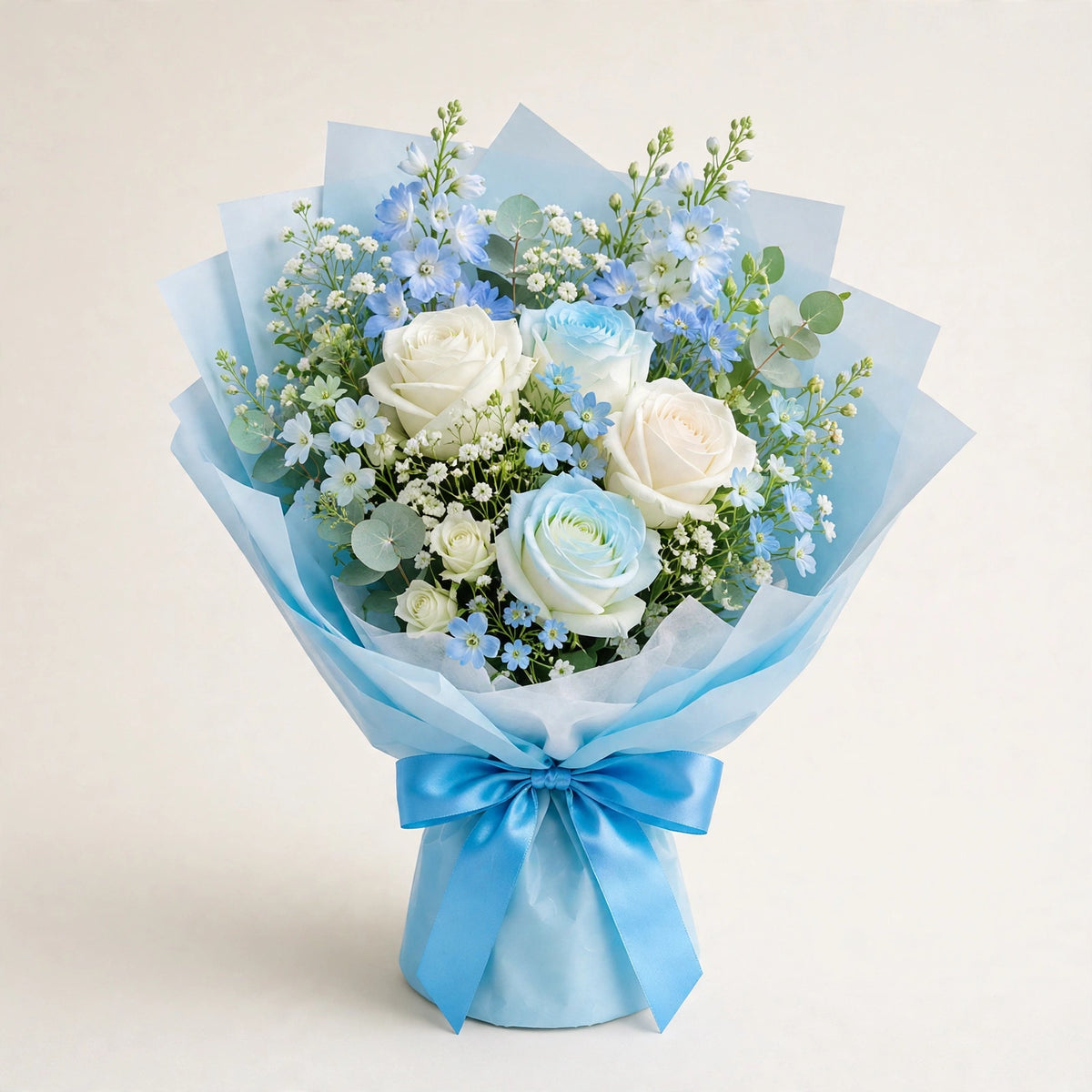 Baby Blue Dream Bouquet — white and soft blue roses with baby's breath and eucalyptus in a light-blue wrap, hand-arranged by LaLa Florist in Baldwin Park