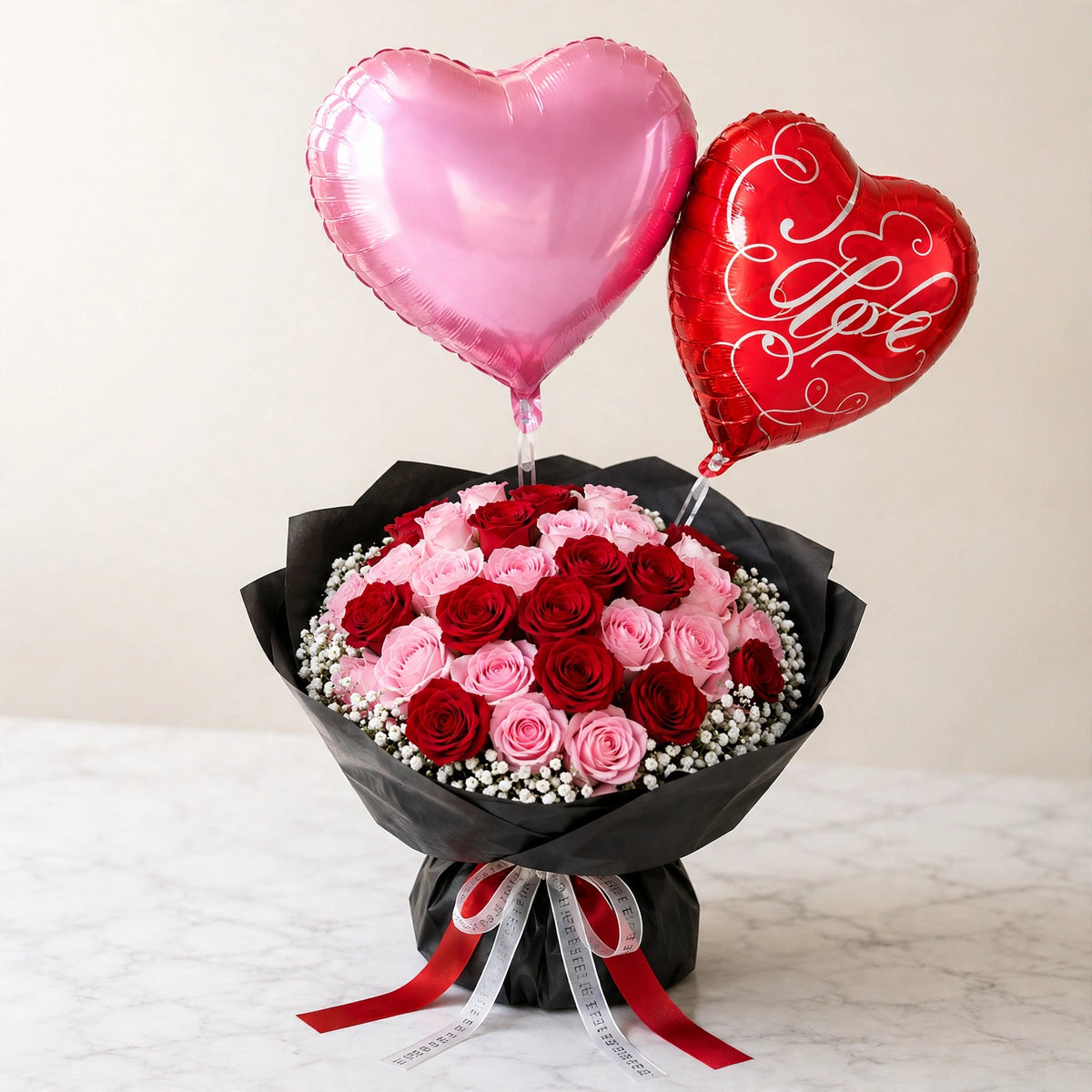Roses Love Bouquet — red and pink roses hand-wrapped in black paper with heart-shaped balloons, by LaLa Florist in Baldwin Park