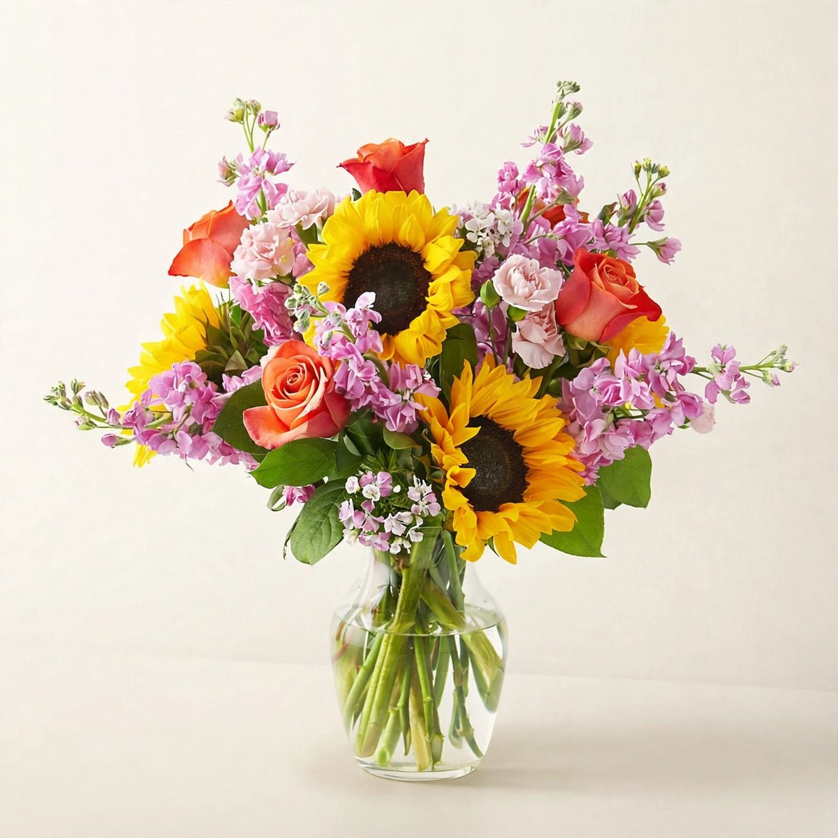 Yellow Brick Road Bouquet — sunflowers with roses and seasonal blooms in a clear glass vase, hand-arranged by LaLa Florist in Baldwin Park, detail view