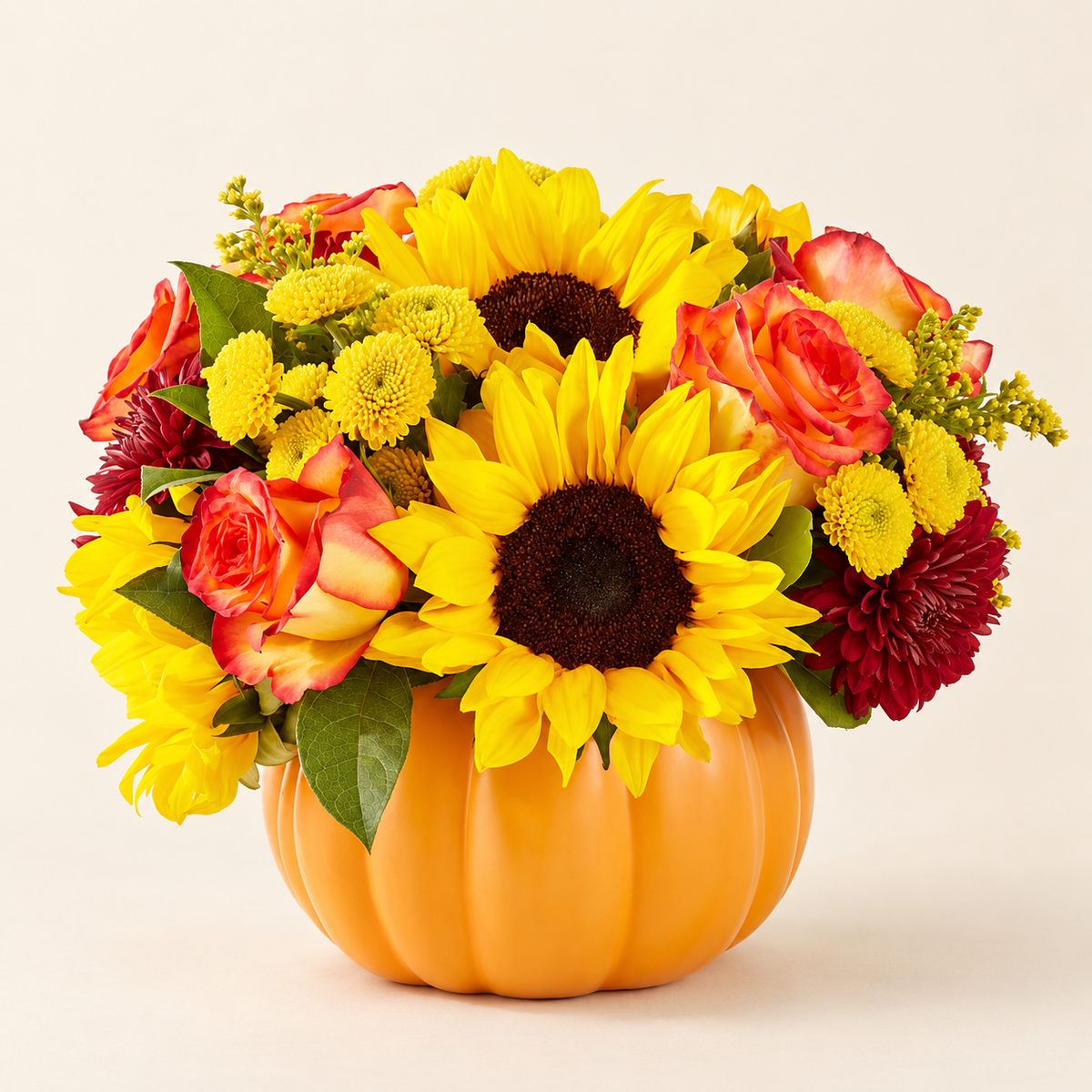 Close-up of golden pumpkin bouquet with sunflowers and roses from Baldwin Park florist