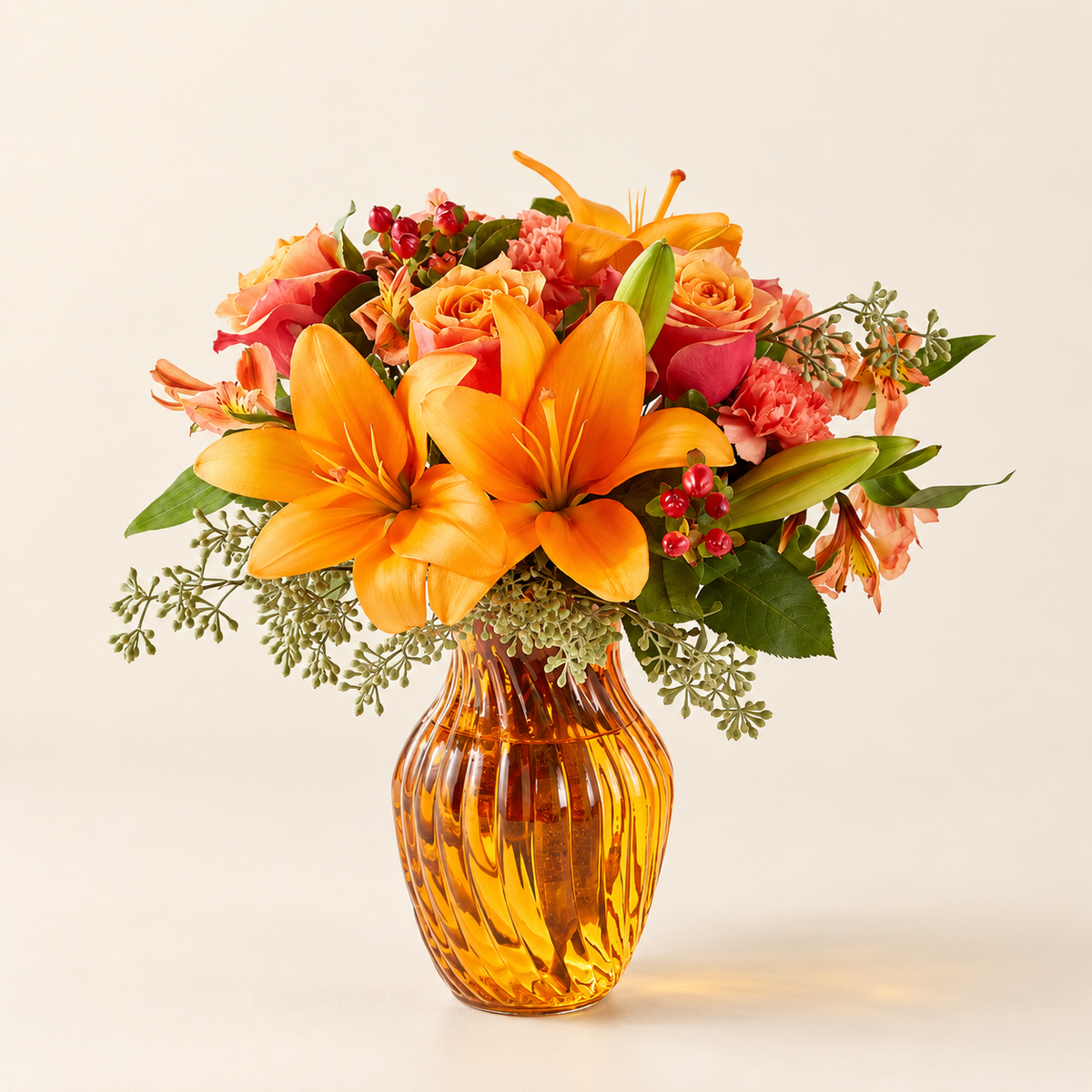 Orange flower arrangement with lilies, roses and alstroemeria
