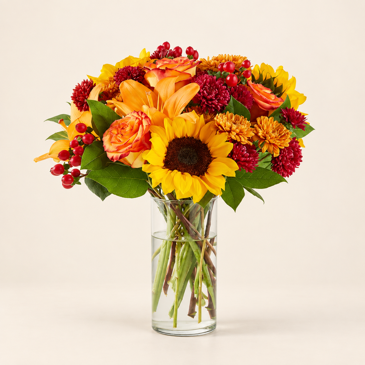 Warm fall flower arrangement with sunflowers, roses, lilies and aster
