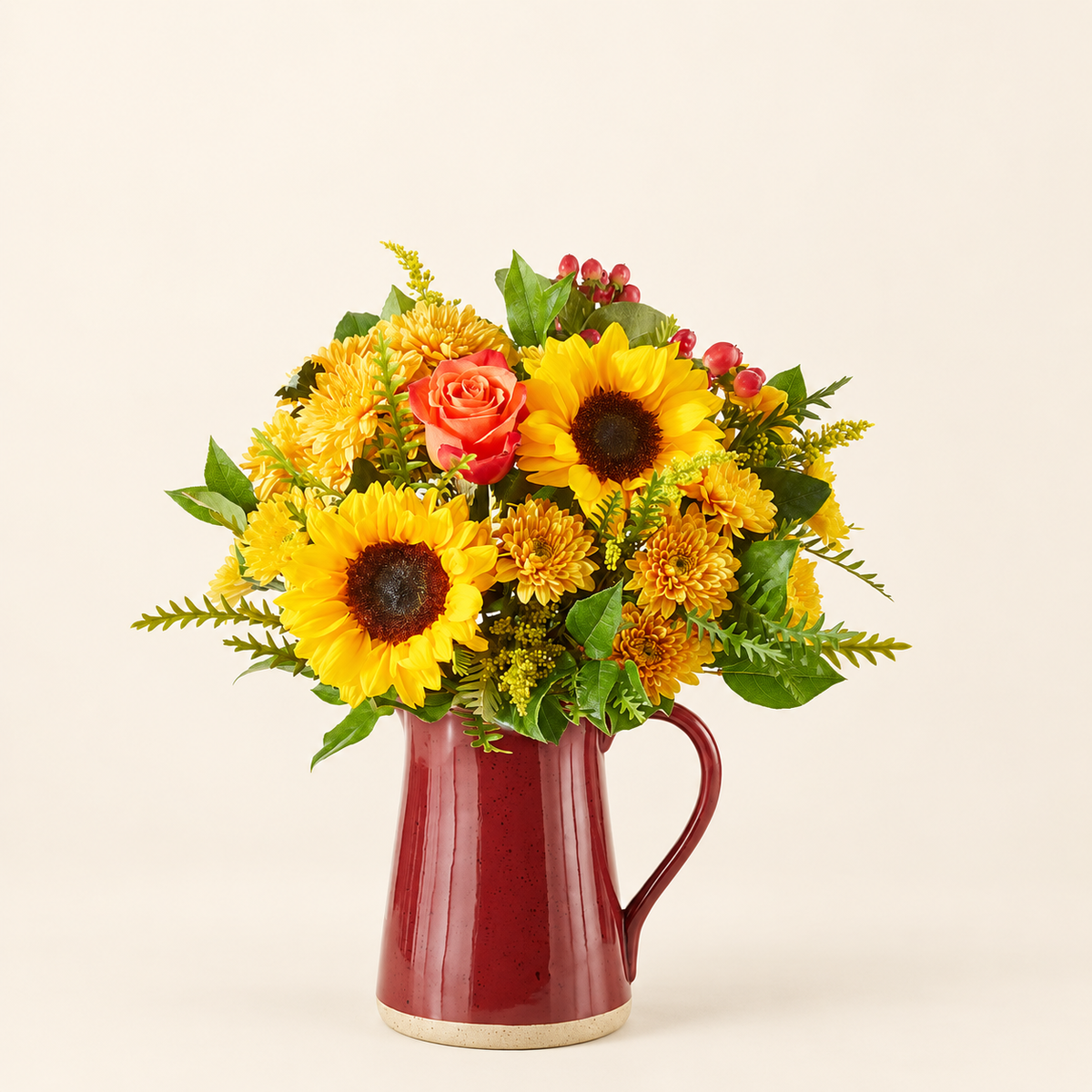 Sunflower and rose fall bouquet in a red pitcher vase, arranged by Baldwin Park florist
