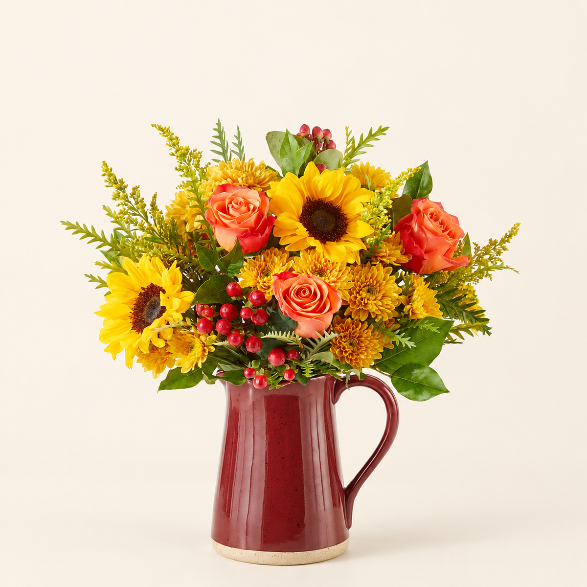 Close-up of sunflowers, orange roses, and golden cushion poms in a rustic fall bouquet
