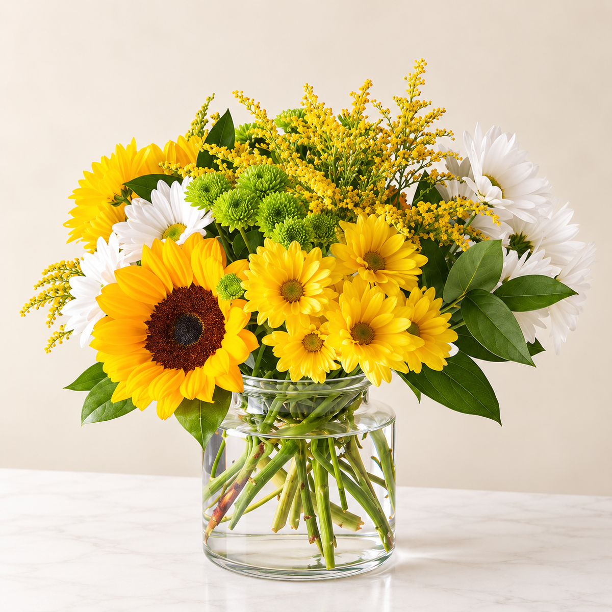 Hello Sunshine bouquet with golden sunflowers, white daisies and yellow blooms in a clear glass vase, hand-arranged by Baldwin Park florist