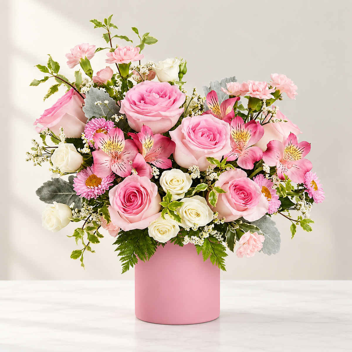 Pink Aura bouquet with soft pink roses, white blooms and pink accents in a blush pink vase, hand-arranged by Baldwin Park florist