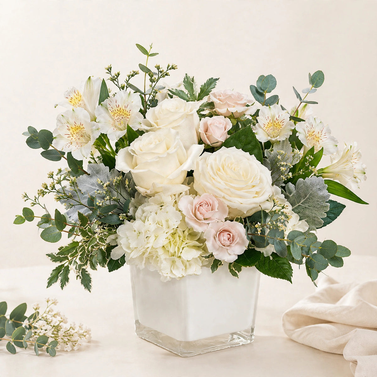 Ivory Garden Bouquet — creamy white roses, blush spray roses and hydrangea in a white cube vase by LaLa Florist in Baldwin Park