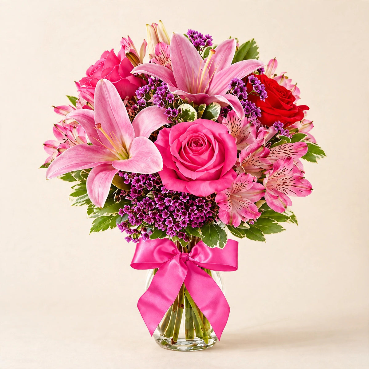 Sweet Rose & Lily Bouquet — pink lilies and roses with a pink satin bow in a glass vase by LaLa Florist in Baldwin Park
