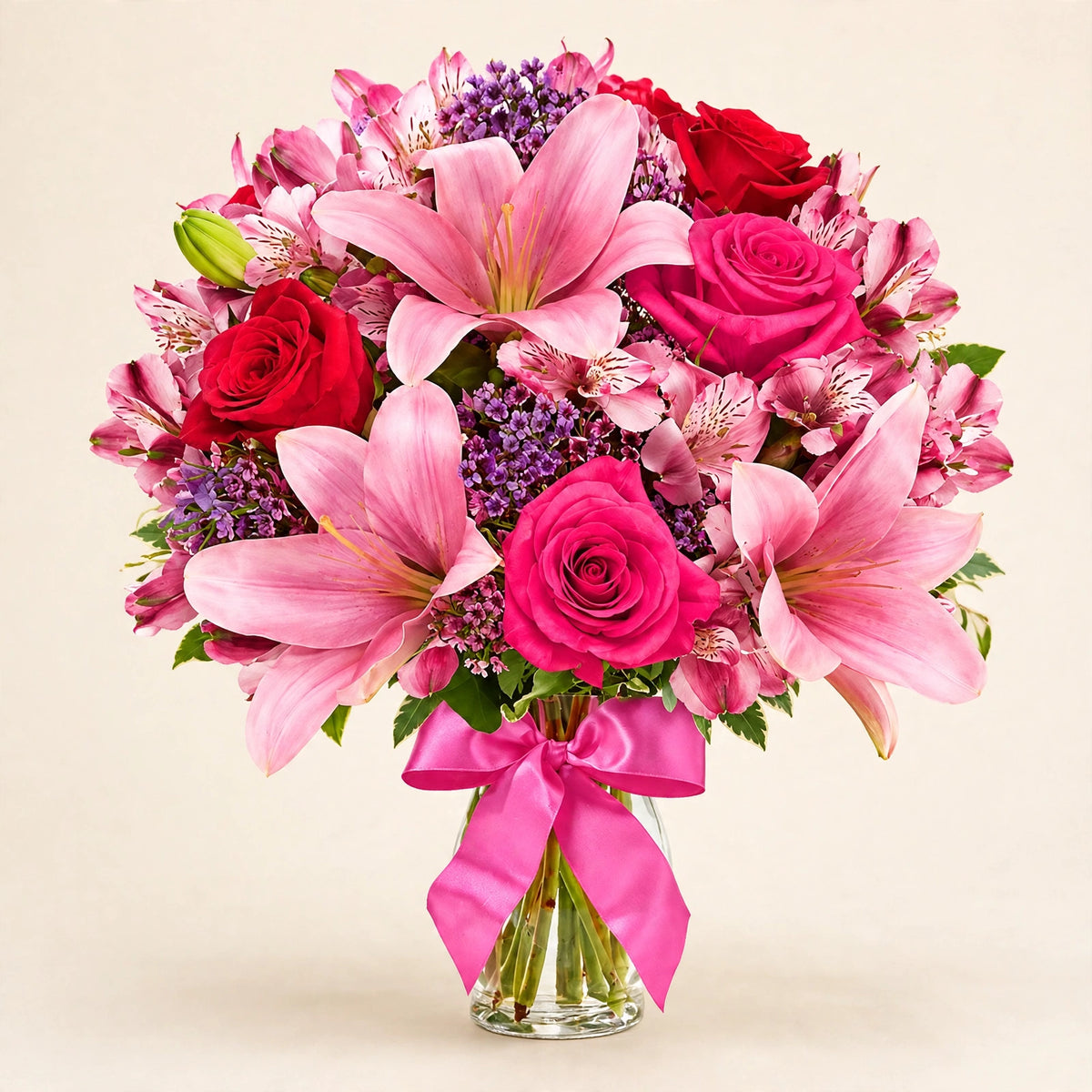 Sweet Rose & Lily Bouquet — pink lilies and roses with a pink satin bow in a glass vase by LaLa Florist in Baldwin Park