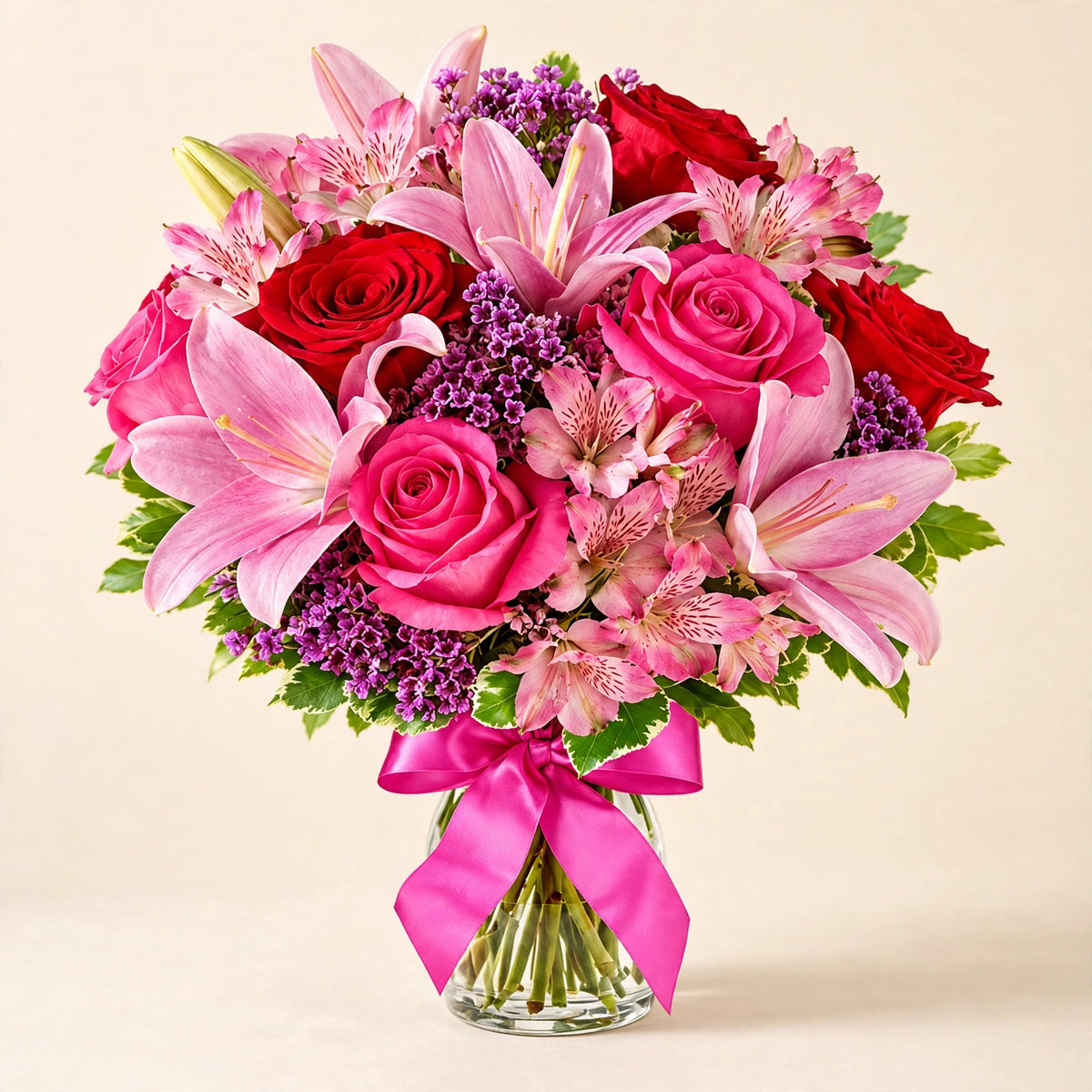 Sweet Rose & Lily Bouquet — pink lilies and roses with a pink satin bow in a glass vase by LaLa Florist in Baldwin Park