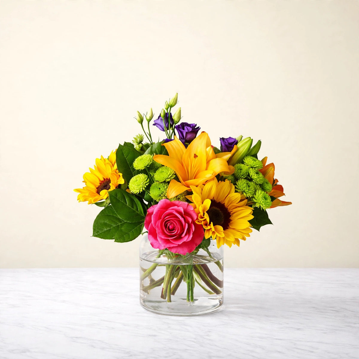 Best Day Bouquet — sunflowers, yellow lilies, hot pink roses, purple lisianthus and green hydrangea in a clear glass vase, hand-arranged by LaLa Florist in Baldwin Park, alternate view