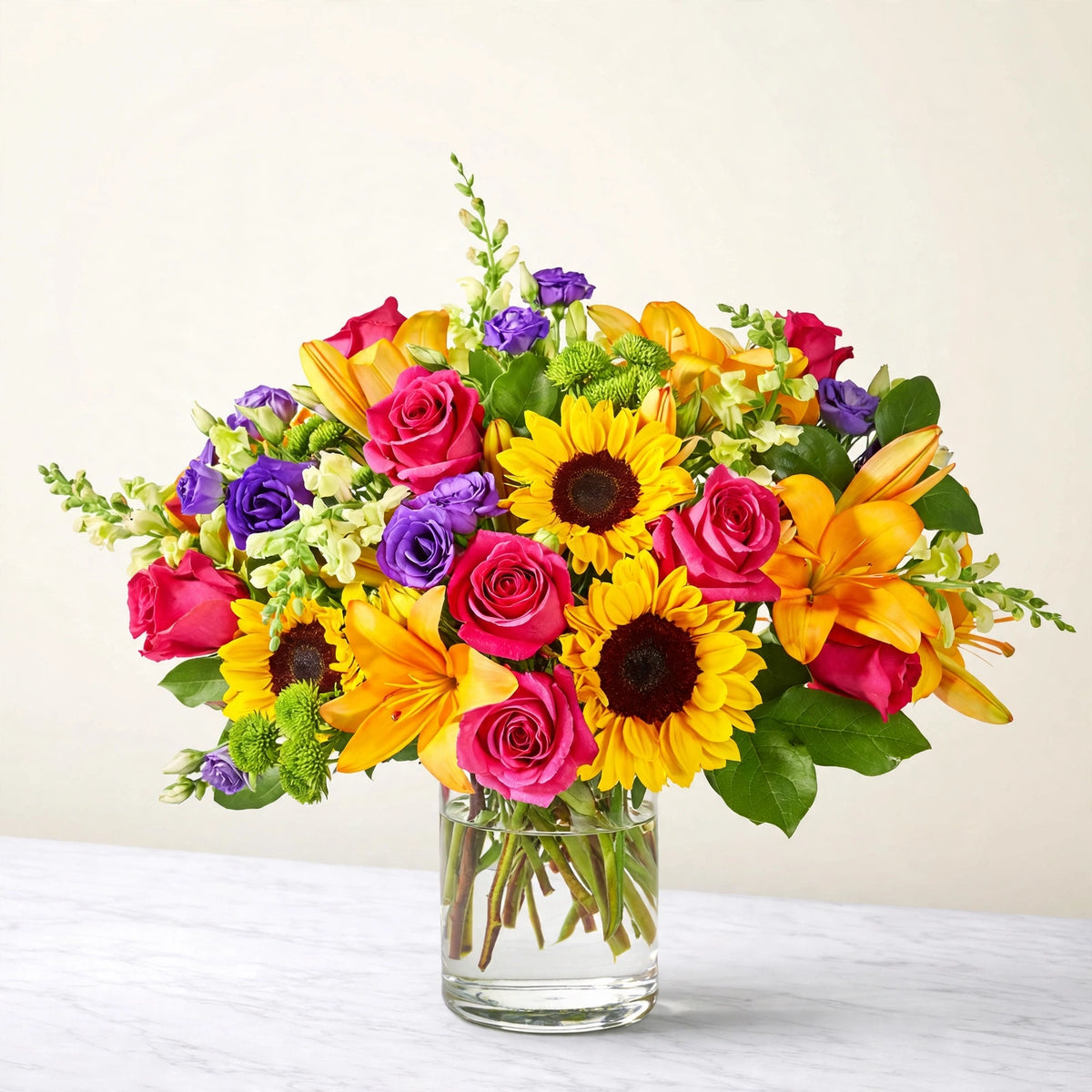 Best Day Bouquet — sunflowers, yellow lilies, hot pink roses, purple lisianthus and green hydrangea in a clear glass vase, hand-arranged by LaLa Florist in Baldwin Park, fuller display view