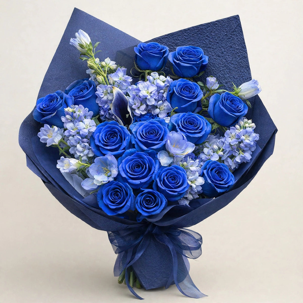 Blue Garden Rose Bouquet — fresh dyed blue roses with seasonal light-blue flowers in a dark-blue wrap, hand-tied by LaLa Florist in Baldwin Park