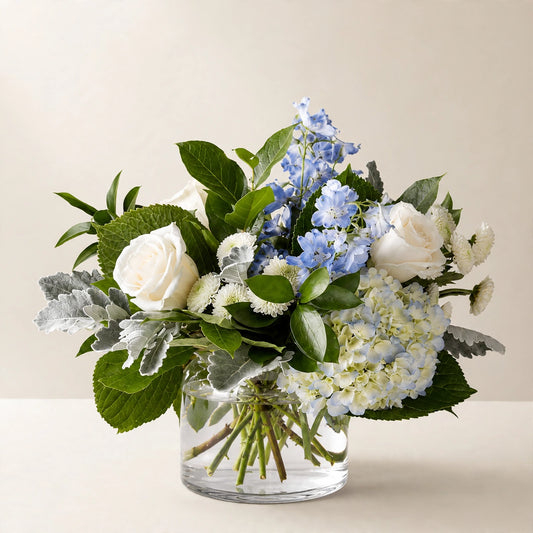 Clear Skies Bouquet with blue hydrangea, white roses and blue delphinium in a clear glass vase by LaLa Florist, Baldwin Park sympathy flowers