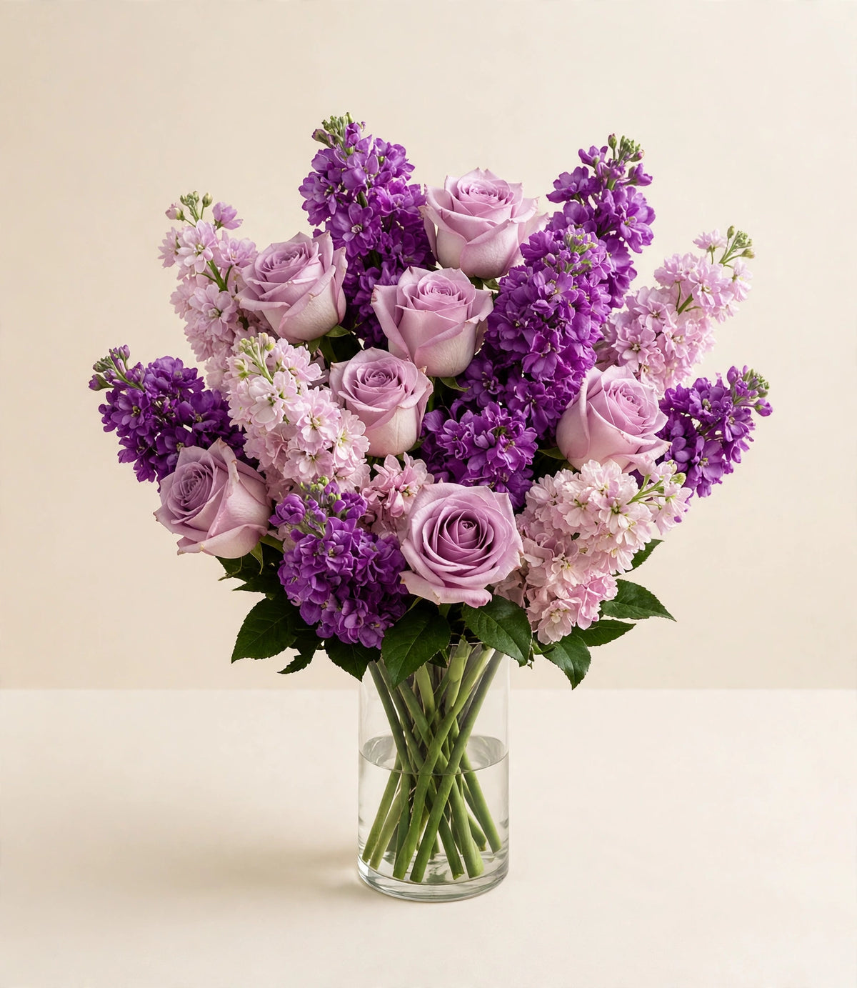 Lavender Sweet Devotion — lavender roses and purple stock flowers in a clear glass vase by LaLa Florist in Baldwin Park