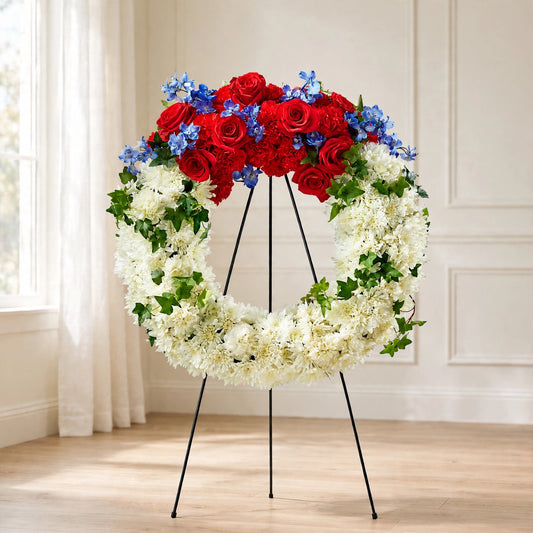 Patriotic Passion Wreath with red roses, white chrysanthemums and blue hydrangea on a standing easel by LaLa Florist, Baldwin Park funeral flowers