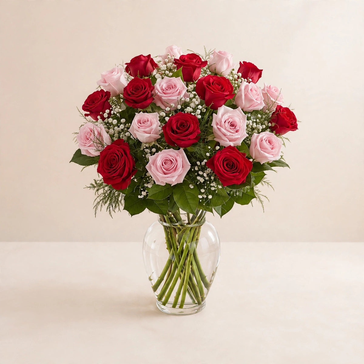 Romantic Blush Rose Arrangement — red and blush pink roses in a clear glass vase by LaLa Florist in Baldwin Park