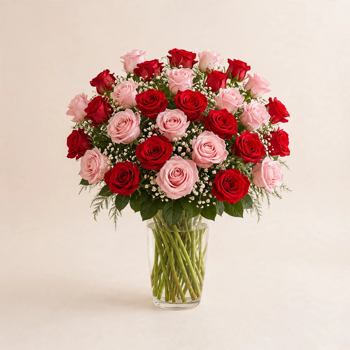 Romantic Blush Rose Arrangement — red and blush pink roses in a clear glass vase by LaLa Florist in Baldwin Park