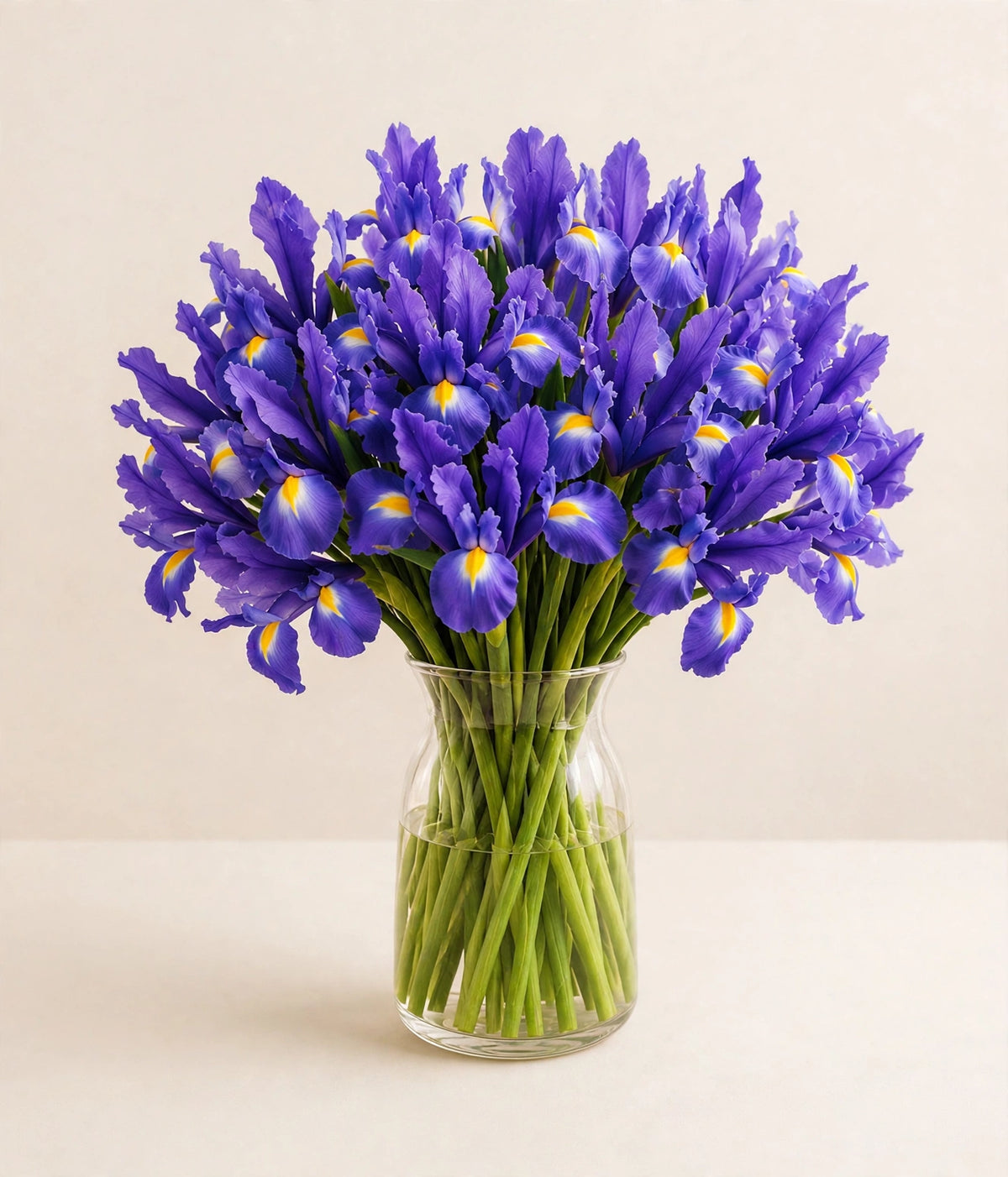 Royal Iris Bouquet — vibrant purple irises in a clear glass vase by LaLa Florist in Baldwin Park