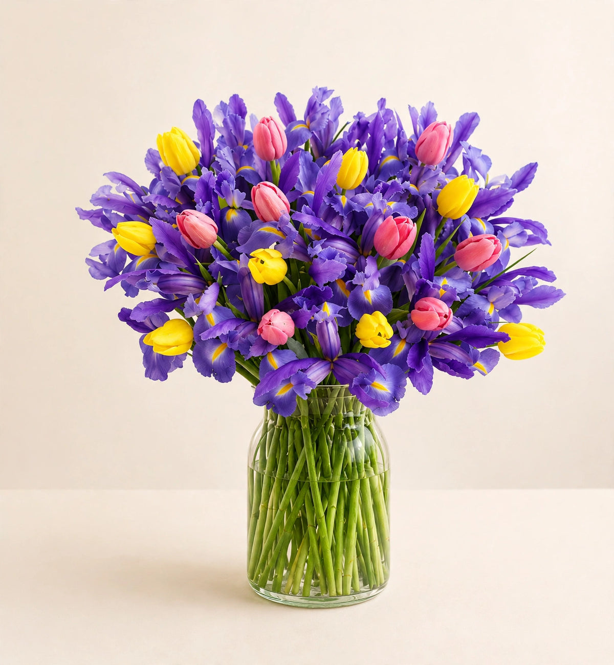 Royal Iris Bouquet — vibrant purple irises in a clear glass vase by LaLa Florist in Baldwin Park