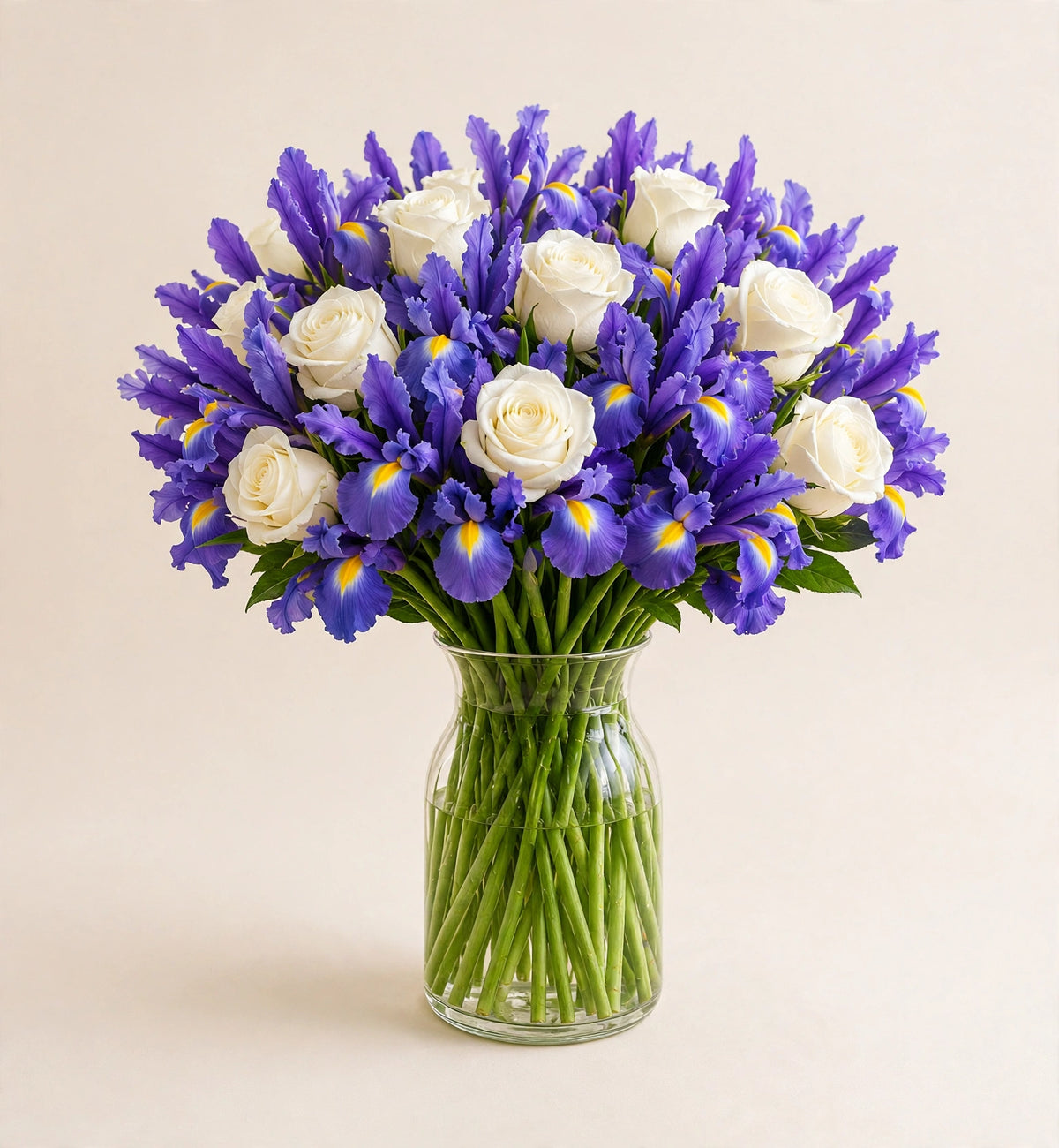 Royal Iris Bouquet — vibrant purple irises in a clear glass vase by LaLa Florist in Baldwin Park