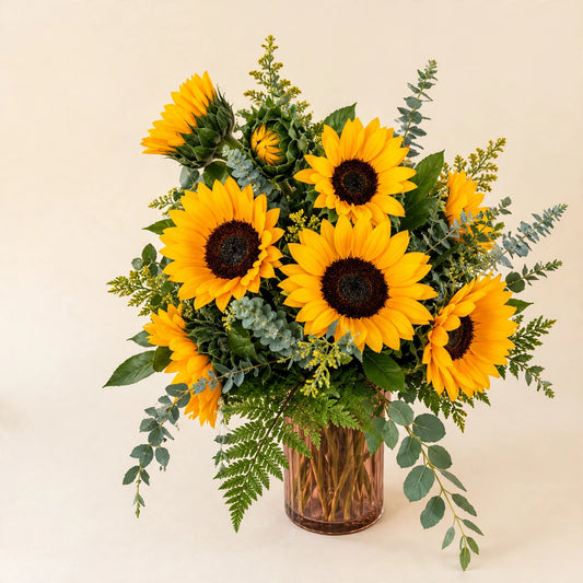 Sunflower Sunshine vase arrangement with golden sunflowers and eucalyptus greenery in a glass vase, hand-arranged by Baldwin Park florist