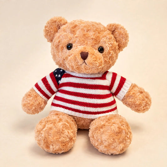 Teddy Bear gift add-on — caramel plush teddy bear wearing a red-and-white striped sweater with a US flag detail, from LaLa Florist in Baldwin Park