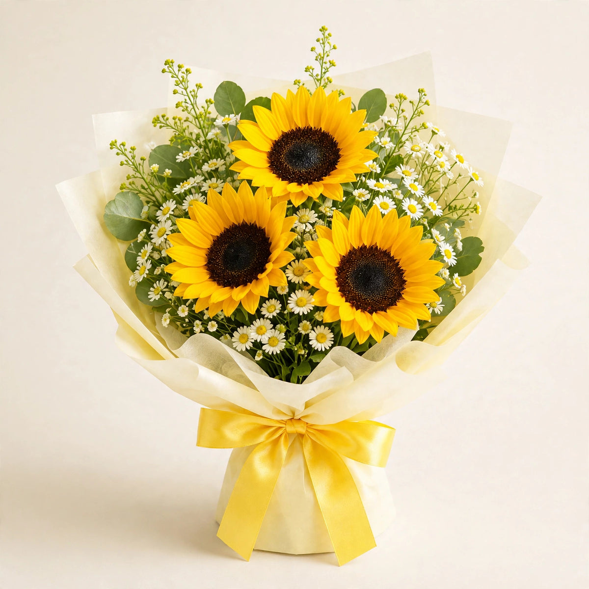 Triple Sunshine Bouquet — three bright sunflowers with white daisies, solidaster and greenery in a cream wrap, hand-arranged by LaLa Florist in Baldwin Park